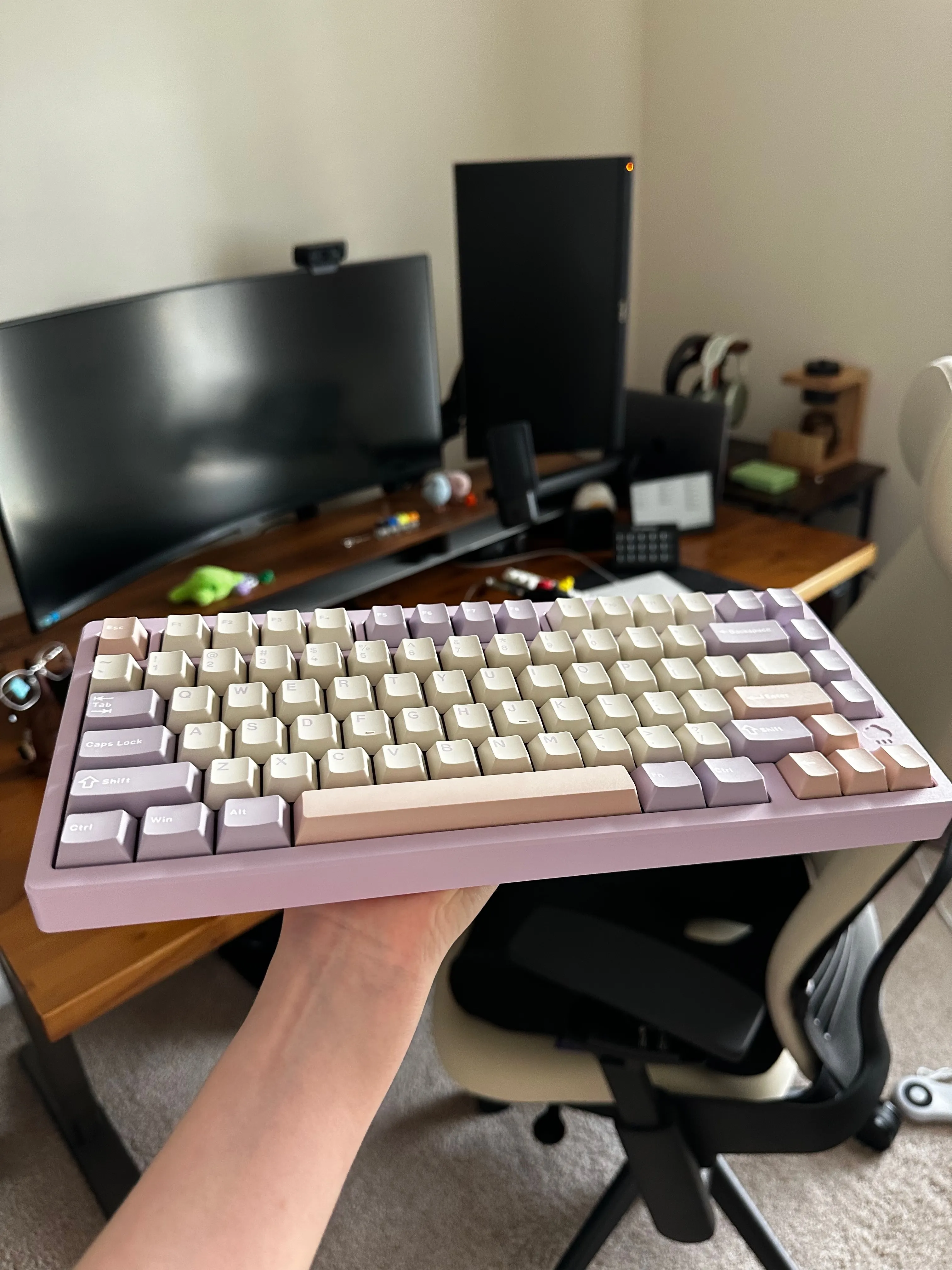 Purple Rainy75 keyboard being held in one hand